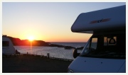 Enlarge photo of campervan in sunset